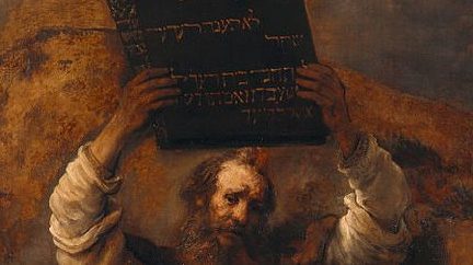 Old painting of Moses holding the Ten Commandments above his head